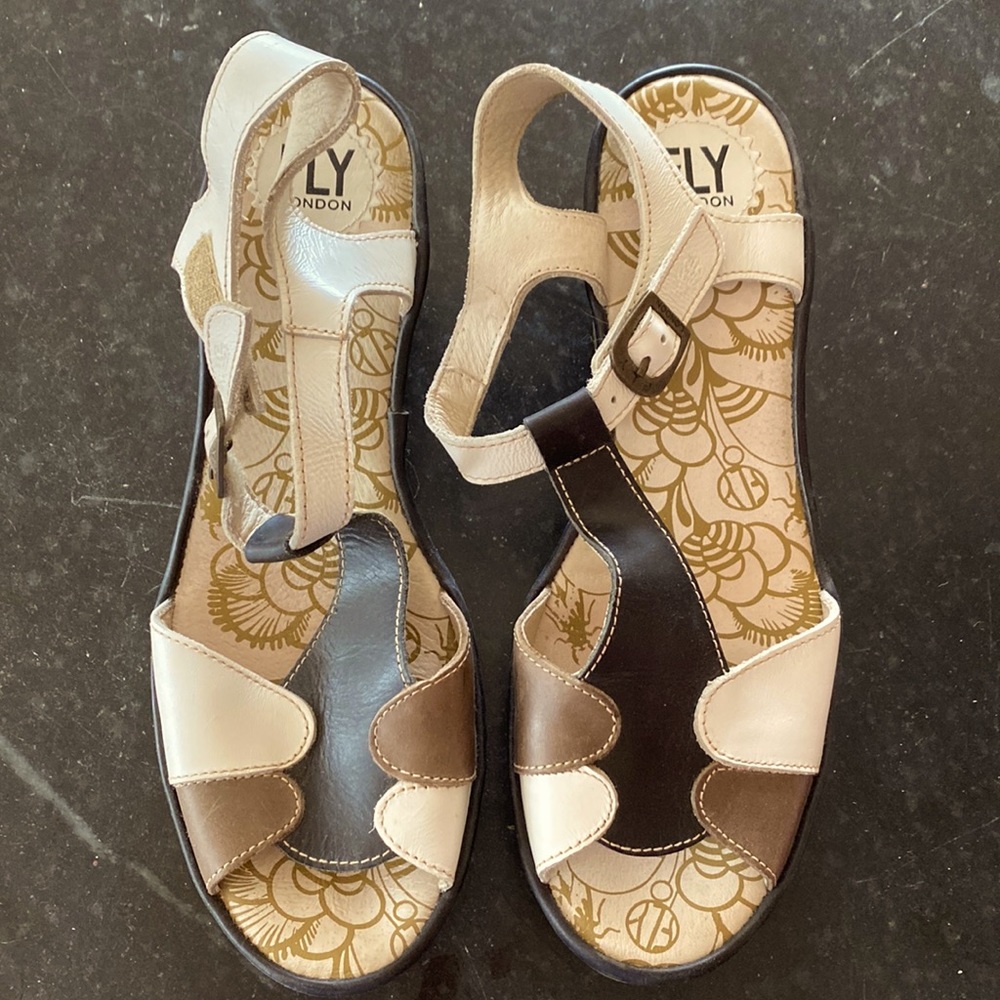 Fly London wedges, black, brown, and white.